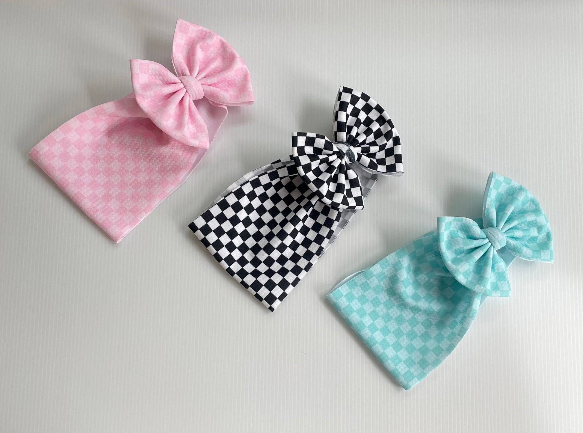 Checkered - Ev's Bowtique Shop, The most comfortable trendy bows for all of your babes. Traditional bows come styled as headwraps, Nylons, clips or pigtail sets! The choice is always yours!