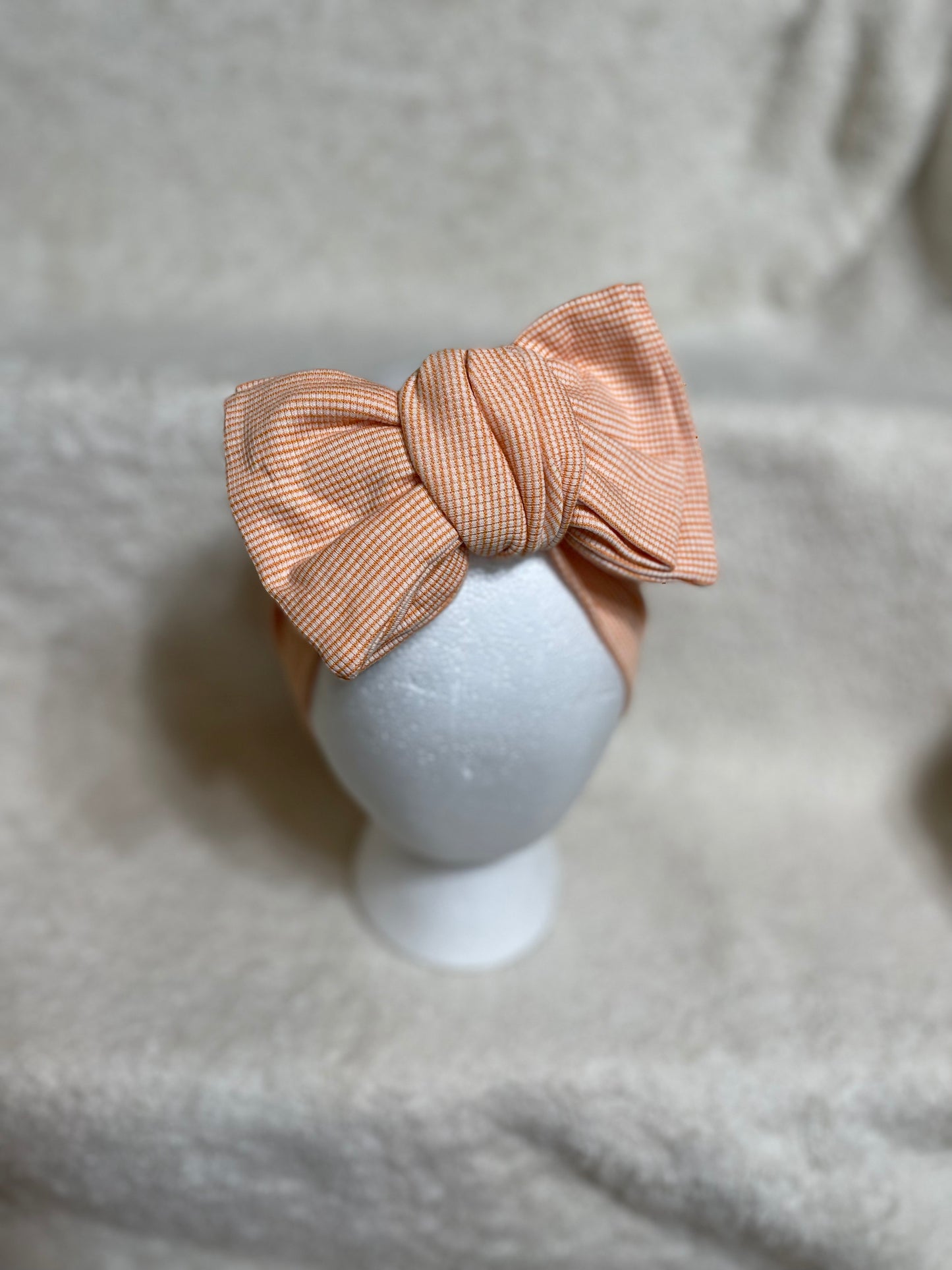 Oversized headwrap - Orange Stripes - Ev's Bowtique Shop Oversized headwraps are made to grow with your babies from newborn, infant to toddler as they are re-tieable/adjustable! Being made from soft stretchy fabric makes them the perfect essential for everyday wear or to make a statement✨ As always handle with care, your bows are delicate items!
